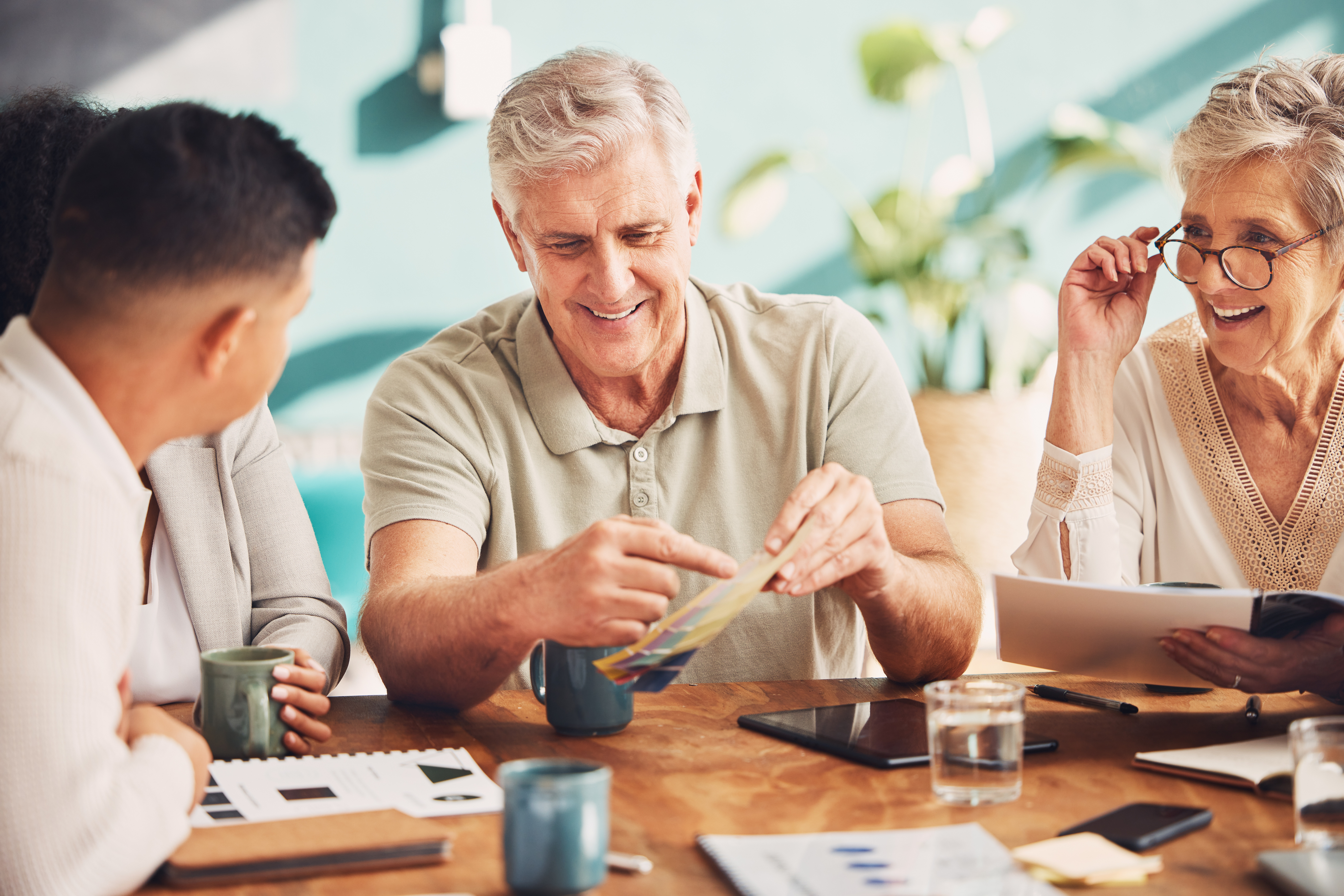 Retirement planning — couple meeting with their adviser